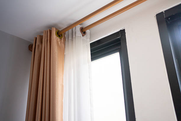 How to Install a Curtain Rod on a Tile or Brick Wall
